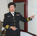 Image of a Woman at a Dry Erase Board